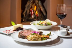 A glass of red wine on a dinner table at an upscale restaurant, representing the setting for a physiological case study on recovery.