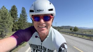 Cycling coach Richard Wharton on his bike in Portola, CA, after a breakthrough ride validating his Physiology First training methodology.