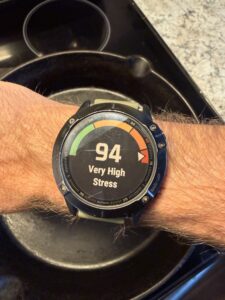 Garmin HRV stress score screen showing 94 (Very High Stress), indicating extreme systemic exhaustion and sympathetic nervous system dominance.