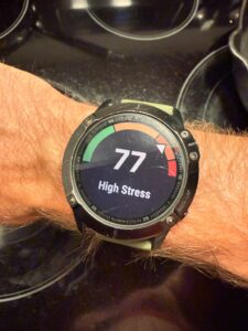 High real-time stress score on Garmin watch validating severe internal load matching fatigue profiles.